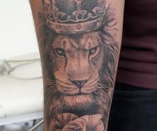 lion crown rose realism tattoo sleeve portrait manchester
