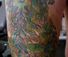 leg sleeve tattoo green man nature